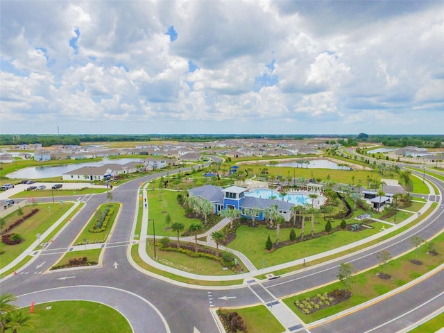 bird's eye view with a water view and a residential view