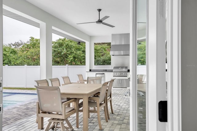 sunroom / solarium featuring ceiling fan