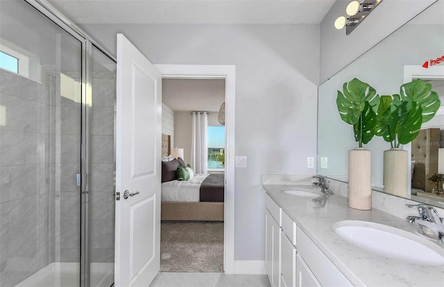 bathroom with tile patterned floors, walk in shower, and vanity