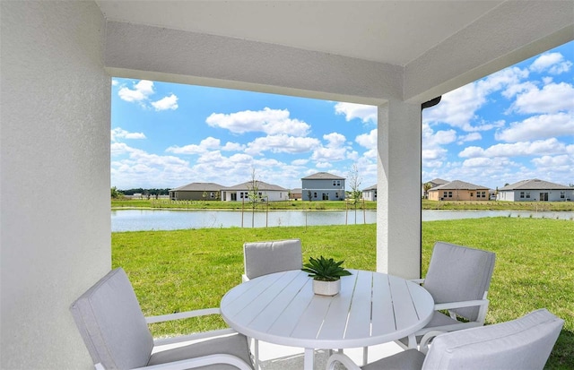 view of patio with a water view