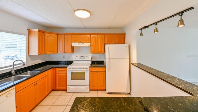 kitchen with sink, a textured ceiling, light tile patterned floors, pendant lighting, and white appliances