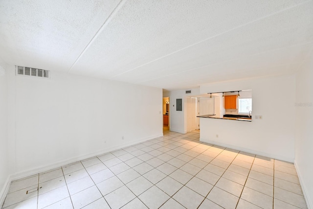 unfurnished living room with a textured ceiling