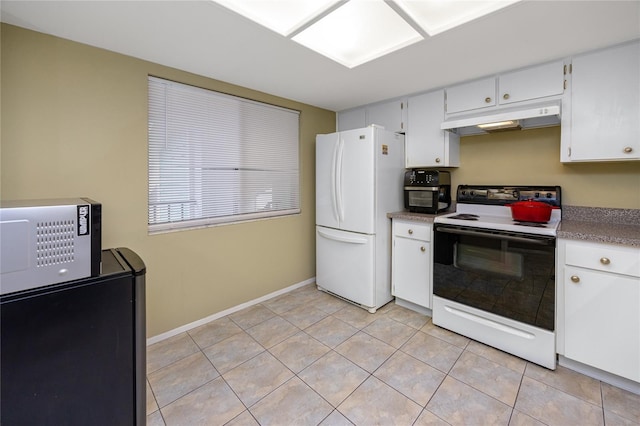 kitchen featuring light tile patterned floors, range with electric cooktop, white cabinetry, and white refrigerator