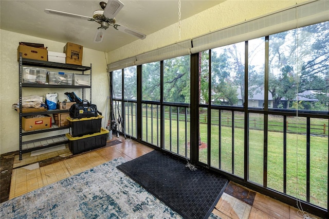 sunroom featuring ceiling fan