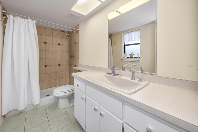 bathroom with a shower with shower curtain, tile patterned flooring, vanity, and toilet