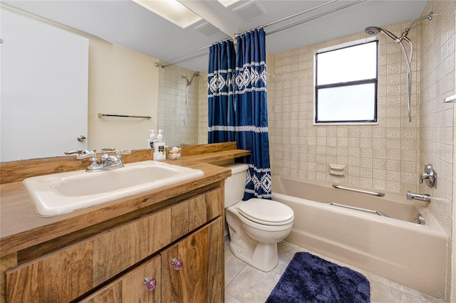 full bathroom with tile patterned flooring, toilet, vanity, and shower / bath combination with curtain