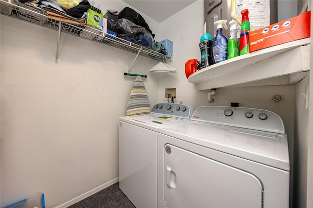 laundry room featuring washing machine and dryer and carpet