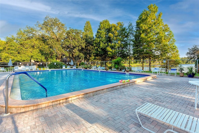 view of swimming pool featuring a patio area