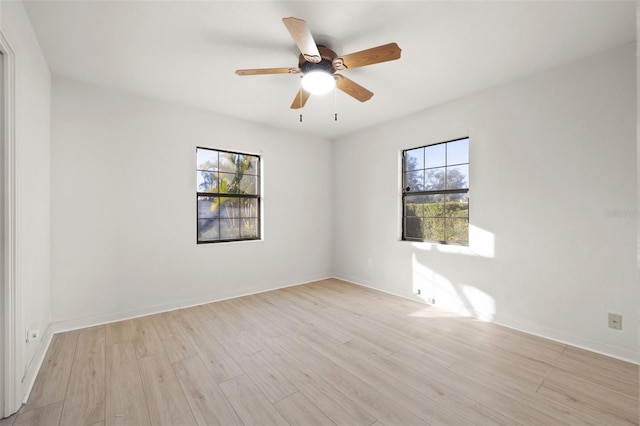 spare room with ceiling fan and light hardwood / wood-style flooring