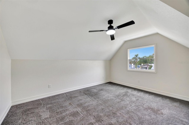 additional living space with ceiling fan, carpet flooring, and vaulted ceiling