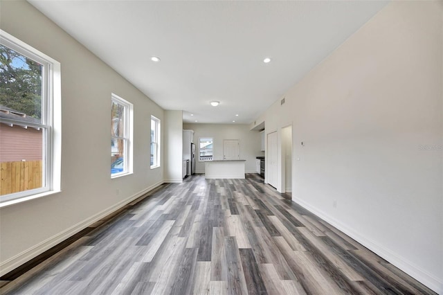 unfurnished living room with hardwood / wood-style flooring