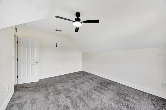 additional living space with ceiling fan, carpet floors, and vaulted ceiling