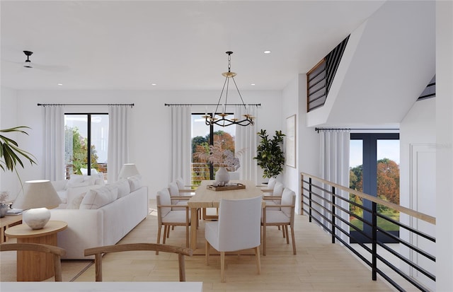 dining area featuring a notable chandelier and light hardwood / wood-style floors