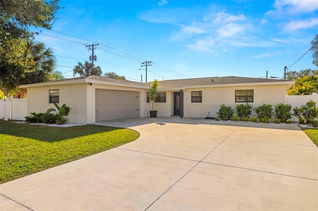 ranch-style house with a garage and a front yard