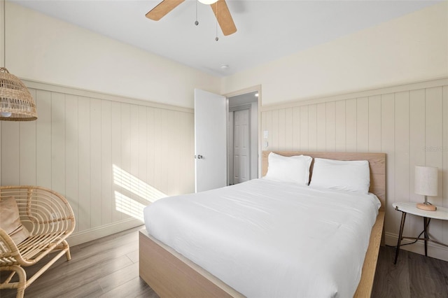 bedroom featuring dark hardwood / wood-style floors and ceiling fan