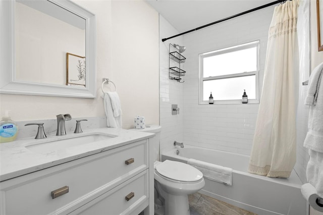 full bathroom featuring shower / tub combo, vanity, and toilet