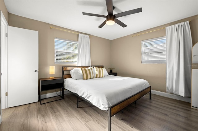 bedroom featuring hardwood / wood-style flooring and ceiling fan