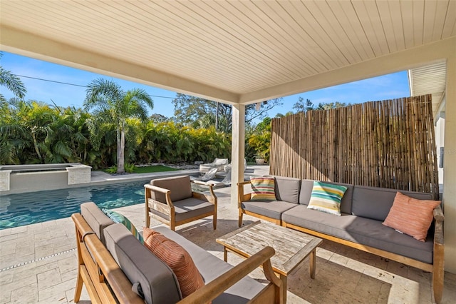 view of patio / terrace with a fenced in pool and an outdoor hangout area