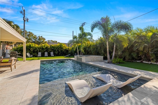 view of pool with an in ground hot tub, a yard, grilling area, and a patio area