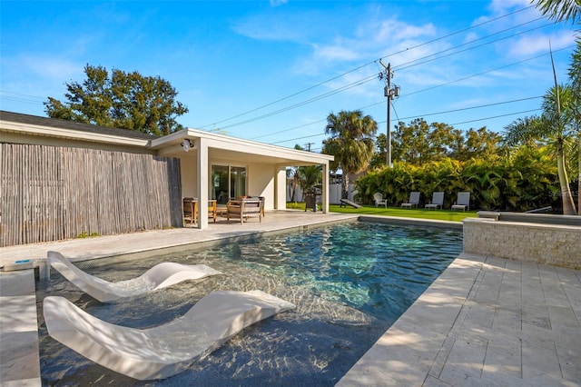 view of swimming pool featuring a patio area