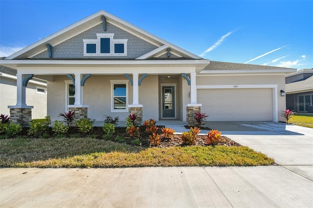 view of front facade with a garage and a porch