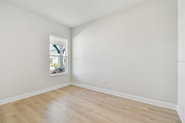 unfurnished room with light wood-type flooring