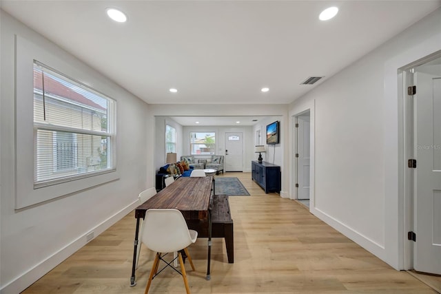 dining area with light hardwood / wood-style flooring