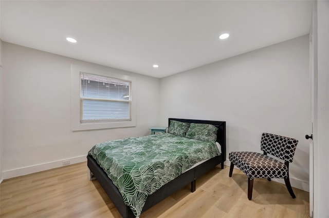 bedroom with light hardwood / wood-style flooring