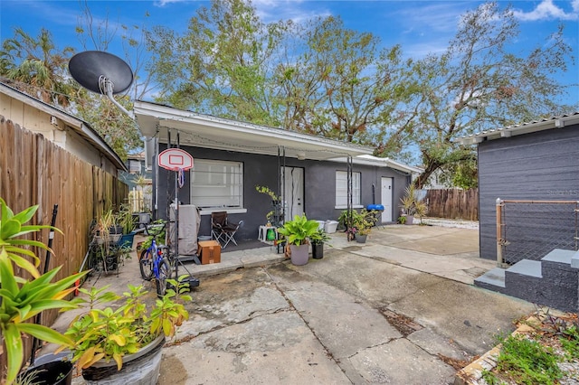 rear view of house featuring a patio