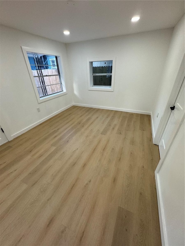 unfurnished room featuring light hardwood / wood-style floors