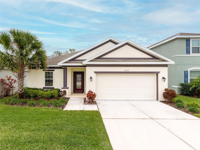 view of front of house with a front yard and a garage