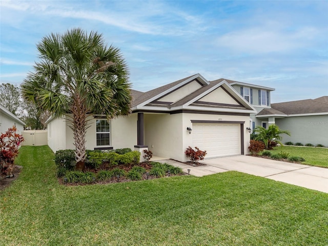 view of front of home featuring a garage and a front lawn