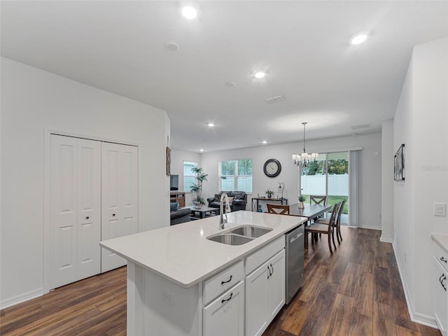 kitchen with decorative light fixtures, white cabinetry, an island with sink, sink, and stainless steel dishwasher