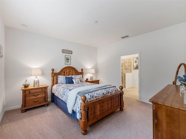 carpeted bedroom with ensuite bathroom