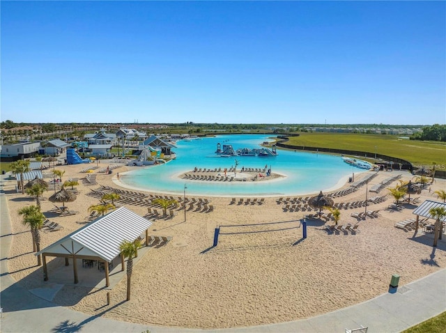 view of pool featuring a water view