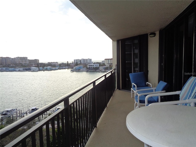 balcony featuring a water view