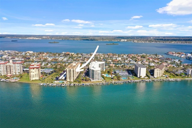 birds eye view of property featuring a water view and a view of city