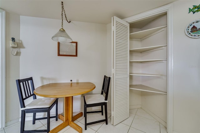 dining area featuring baseboards