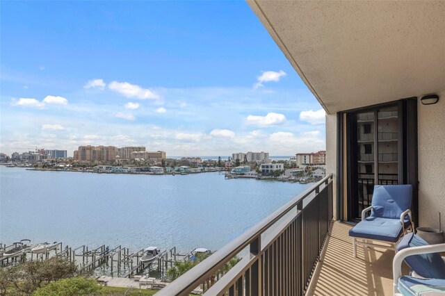 balcony featuring a water view and a view of city