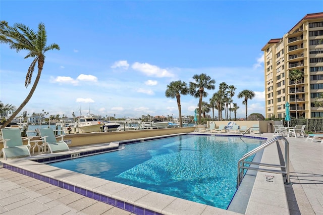 community pool featuring a patio area