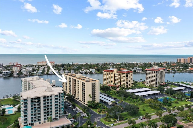 birds eye view of property featuring a water view and a view of city