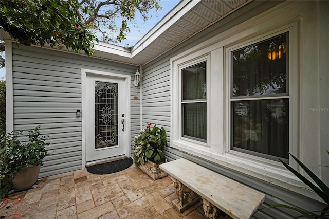 property entrance featuring a patio area