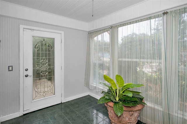 interior space featuring dark tile patterned flooring