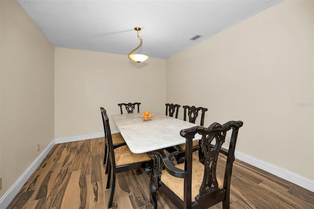 dining room with hardwood / wood-style flooring