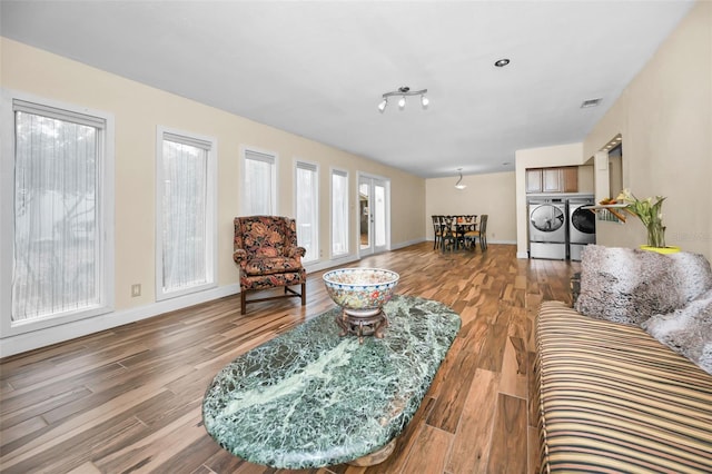 living room featuring hardwood / wood-style flooring and washer and clothes dryer