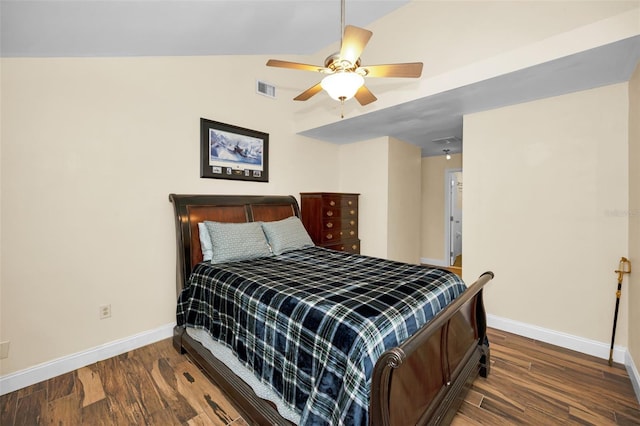 bedroom with lofted ceiling, dark wood-type flooring, and ceiling fan