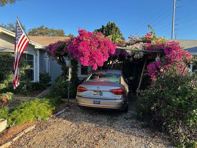 exterior space with a carport