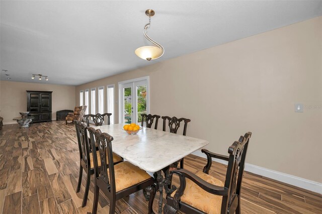 546 Orangewood Dr, Dunedin, FL 34698 - dining area with dark wood finished floors and baseboards