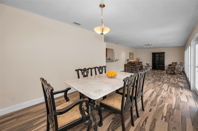 546 Orangewood Dr, Dunedin, FL 34698 - dining area featuring wood finished floors and baseboards