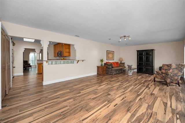 546 Orangewood Dr, Dunedin, FL 34698 - living room featuring wood finished floors and baseboards